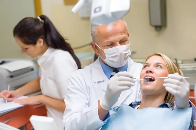 Dentist examining a patient at Prime Dental