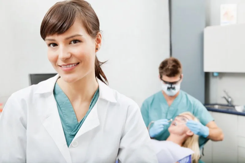 Dental team caring for a patient at Prime Dental